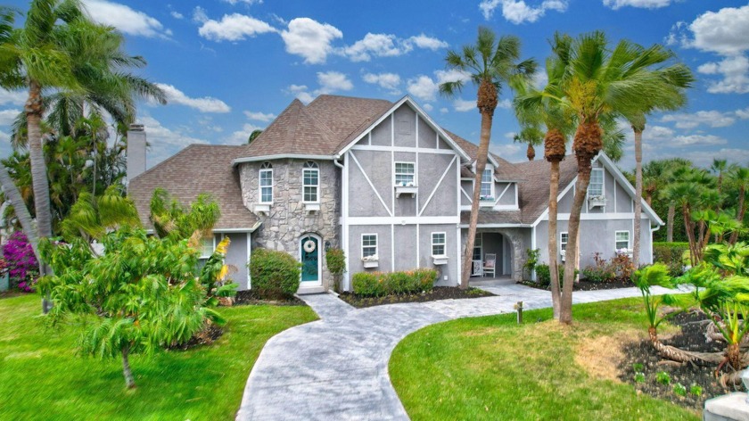 This beautiful OCEAN ACCESS waterfront tudor-style home offers - Beach Home for sale in Hutchinson Island, Florida on Beachhouse.com