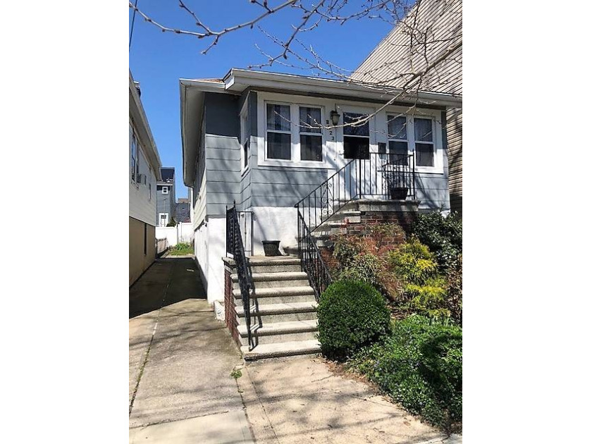 Enter this Charming home through an enclosed front porch that - Beach Home for sale in Bronx, New York on Beachhouse.com