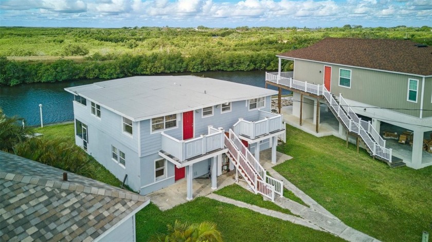 Welcome to this exceptional 3-unit canalfront home, nestled on a - Beach Home for sale in Tampa, Florida on Beachhouse.com
