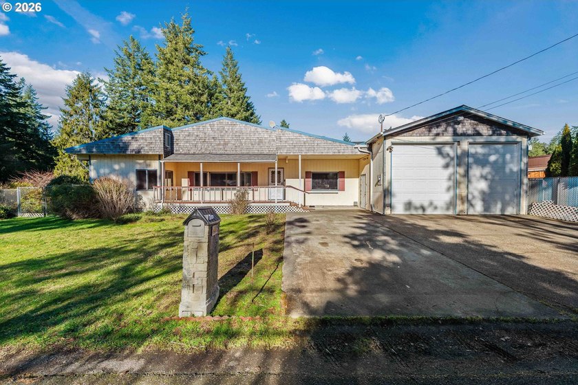 Tucked in the county in Laurel Grove, this 1964 home offers - Beach Home for sale in Bandon, Oregon on Beachhouse.com