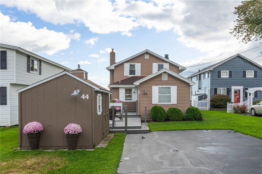 This beautifully updated waterfront home offers an open-concept - Beach Home for sale in Parma, New York on Beachhouse.com