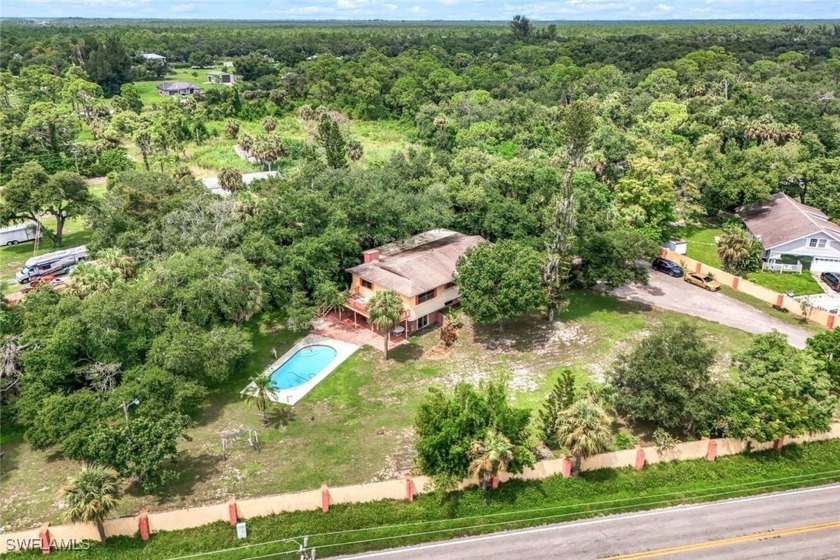 This pool home features 6 bedrooms and 3.5 baths, located on 1.2 - Beach Home for sale in North Fort Myers, Florida on Beachhouse.com