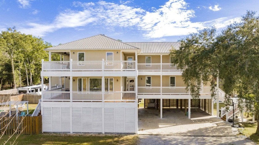 Discover coastal living at its finest in this inviting 5-bedroom - Beach Home for sale in Gulf Shores, Alabama on Beachhouse.com