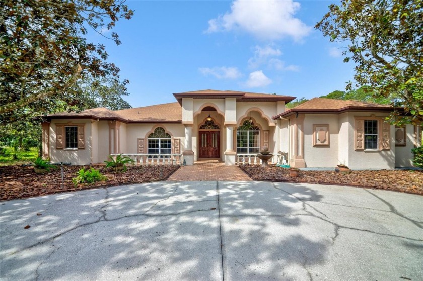 Stunning Remodeled 4-Bedroom, 3-Bathroom Pool Home in Lake in - Beach Home for sale in Spring Hill, Florida on Beachhouse.com