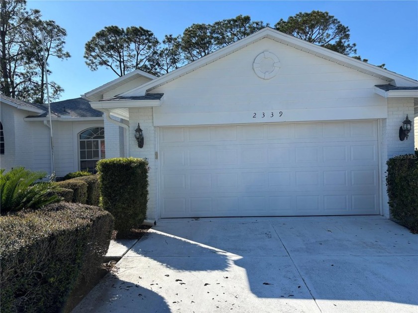 Welcome to this charming 3-bedroom, 2-bathroom home nestled in - Beach Home for sale in Spring Hill, Florida on Beachhouse.com