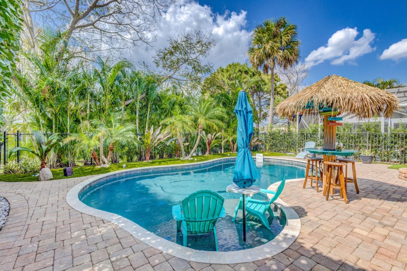 STUNNING LAKEFRONT HOME WITH GORGEOUS POOL & SS SURROUNDED BY - Beach Home for sale in Palm Beach Gardens, Florida on Beachhouse.com