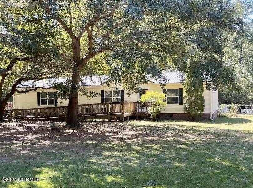 This charming 3-bedroom, 2-bath home is nestled in a - Beach Home for sale in Hampstead, North Carolina on Beachhouse.com