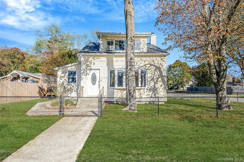 Tucked away on a peaceful quarter-acre lot just minutes from the - Beach Home for sale in Mastic Beach, New York on Beachhouse.com