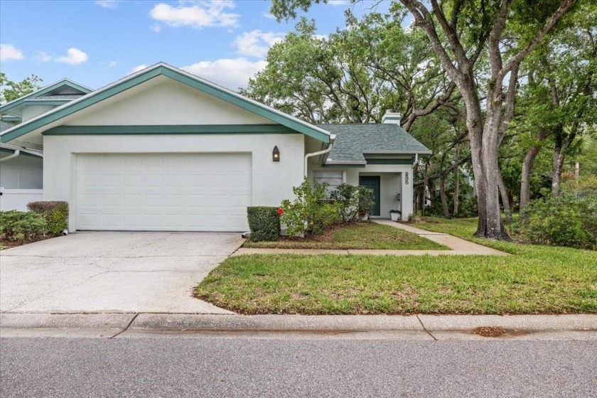BEAUTIFUL SECLUDED WOODRIDGE GREEN VILLA in prestigious East - Beach Home for sale in Oldsmar, Florida on Beachhouse.com