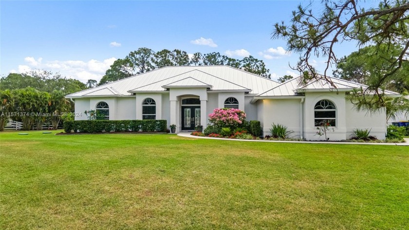Situated on 2 beautifully landscaped acres in Stuart - Beach Home for sale in Palm City, Florida on Beachhouse.com