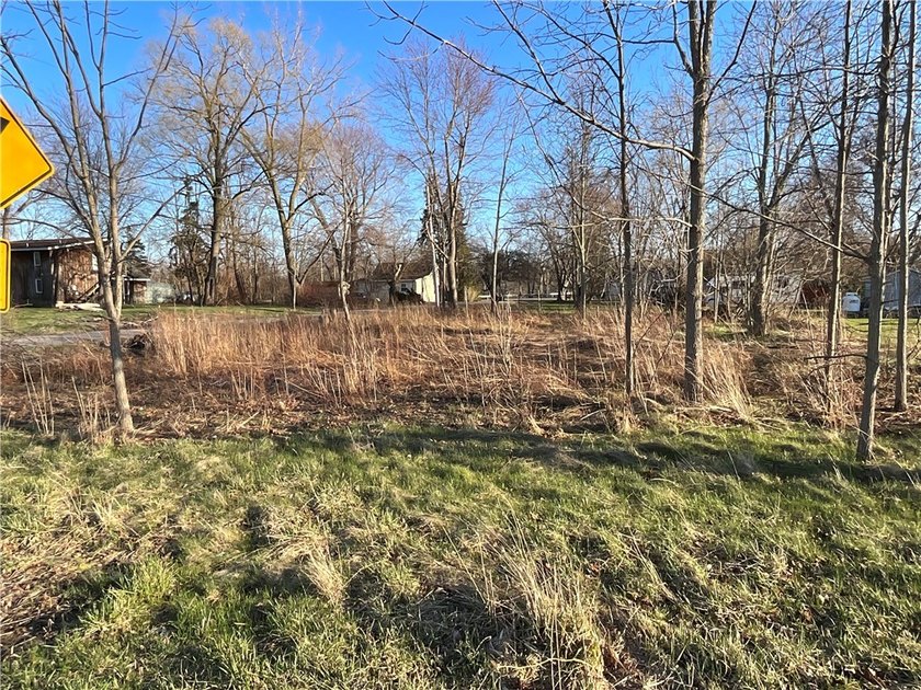 This modest size lot would make for additional elbow space for - Beach Lot for sale in Wilson, New York on Beachhouse.com