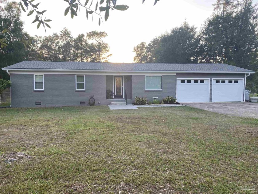 This 3 bedroom 2 bath brick home is situated on .63 acres with - Beach Home for sale in Milton, Florida on Beachhouse.com