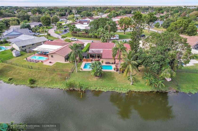 Discover your dream home! This 4/3 retreat is nestled on the - Beach Home for sale in Coral Springs, Florida on Beachhouse.com