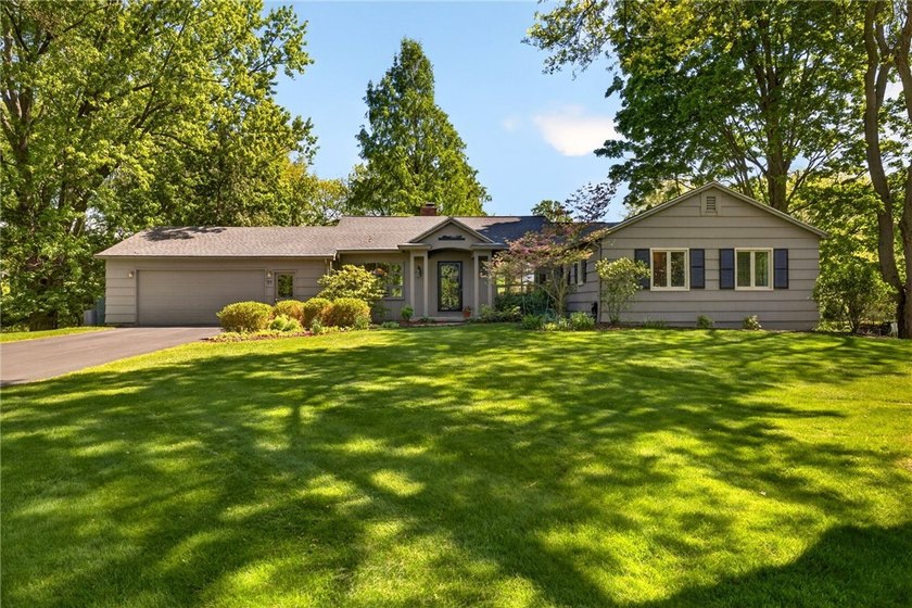 Perched above the fairways of Irondequoit Country Club, this - Beach Home for sale in Rochester, New York on Beachhouse.com