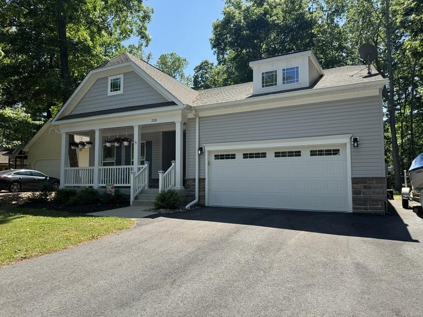 This beautiful home with a .37-acre wooded lot is located on a - Beach Home for sale in Greenbackville, Virginia on Beachhouse.com