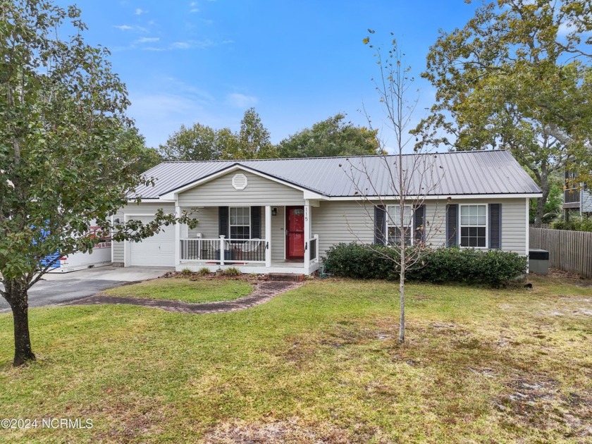 LOCATION, LOCATION, LOCATION! This home situated on an elevated - Beach Home for sale in Oak Island, North Carolina on Beachhouse.com