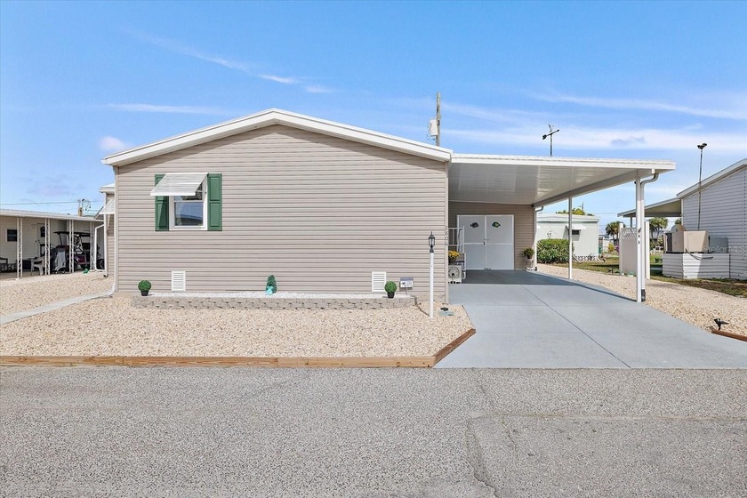 BEAUTIFUL TRIPLE-WIDE HOME on OVERSIZED 1.5 Lots in TROPIC ISLES - Beach Home for sale in Palmetto, Florida on Beachhouse.com