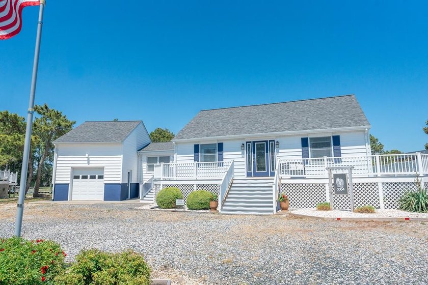 Tucked away on beautiful Chincoteague, this stunning waterfront - Beach Home for sale in Chincoteague Island, Virginia on Beachhouse.com