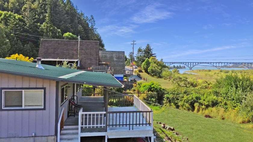 Discover your serene haven in the gated 55+ community of Harbor - Beach Home for sale in Gold Beach, Oregon on Beachhouse.com