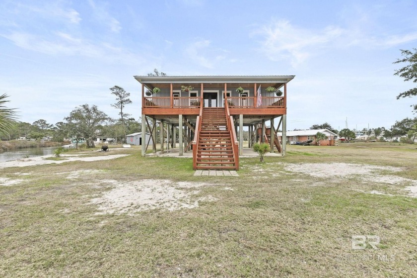 Welcome to this stunning custom-built GOLD Fortified raised - Beach Home for sale in Gulf Shores, Alabama on Beachhouse.com