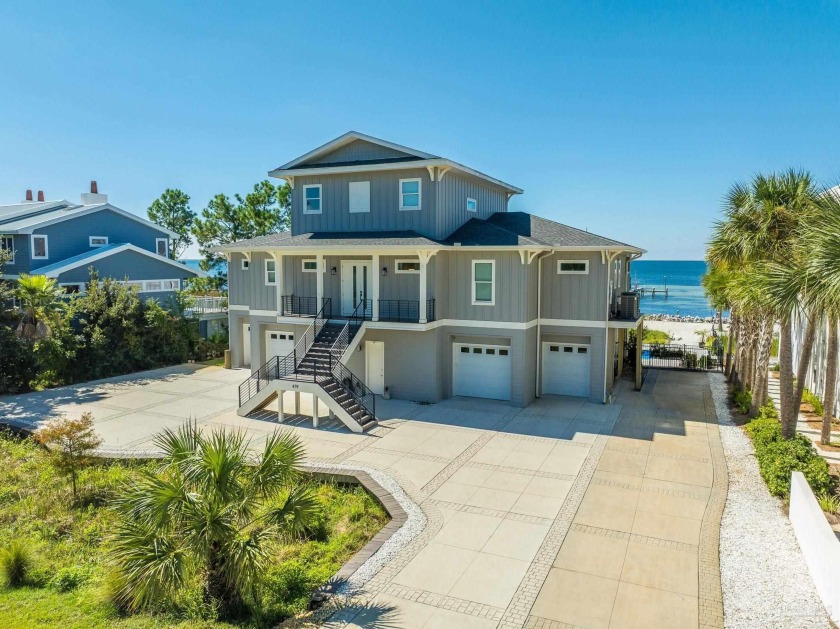 Welcome to this stunning waterfront pool home in the Deer Point - Beach Home for sale in Gulf Breeze, Florida on Beachhouse.com