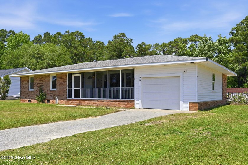 Welcome home to this charming 3-bedroom cottage-style home with - Beach Home for sale in Sneads Ferry, North Carolina on Beachhouse.com
