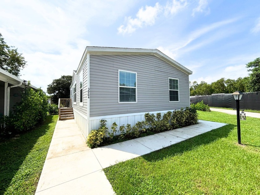 Community: Whispering Pines  Ages: All Ages  Location: Boynton - Beach Home for sale in Boynton Beach, Florida on Beachhouse.com