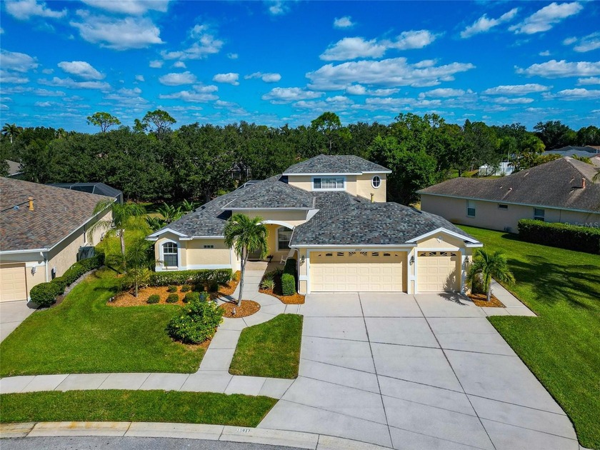 This beautifully maintained five-bedroom, three-bath pool home - Beach Home for sale in Lakewood Ranch, Florida on Beachhouse.com