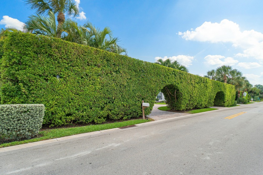 This gem is hidden by large private Palm Beach arched hedges - Beach Home for sale in Jupiter Inlet Colony, Florida on Beachhouse.com