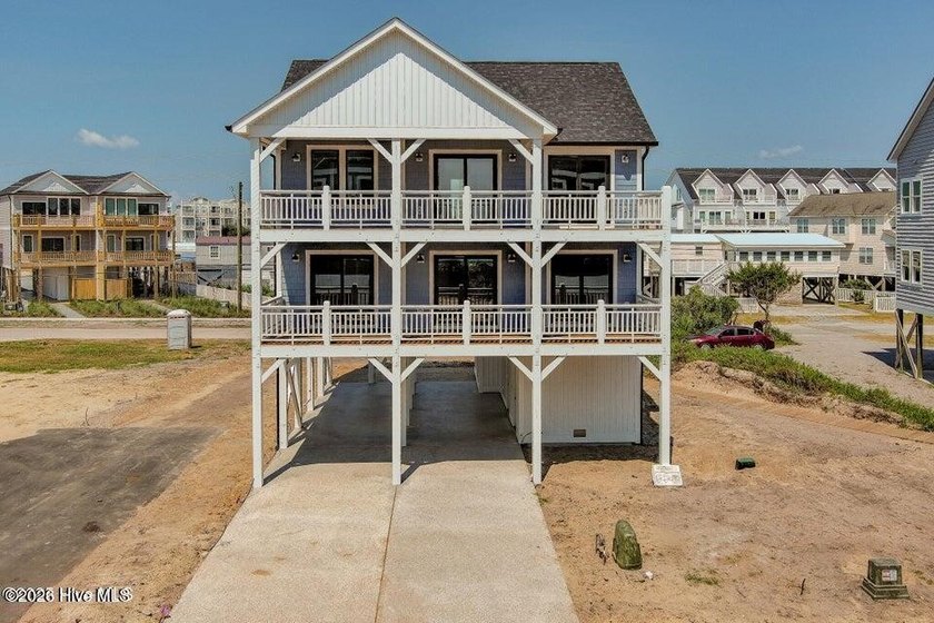 Wow, this Ocean Side Beauty has incredible ocean views! Mere - Beach Home for sale in Surf City, North Carolina on Beachhouse.com