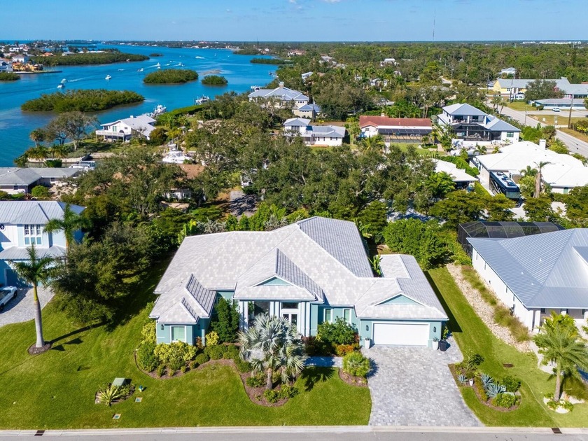 This stunning coastal-designed residence is perfectly situated - Beach Home for sale in Nokomis, Florida on Beachhouse.com