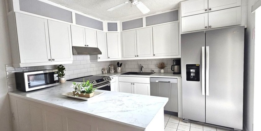 Relax in your private paradise amongst towering palm trees. This - Beach Townhome/Townhouse for sale in Vero Beach, Florida on Beachhouse.com