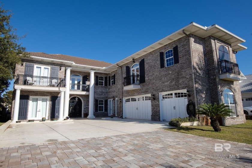 This six-bedroom, five-bath home offers a refined waterfront - Beach Home for sale in Orange Beach, Alabama on Beachhouse.com