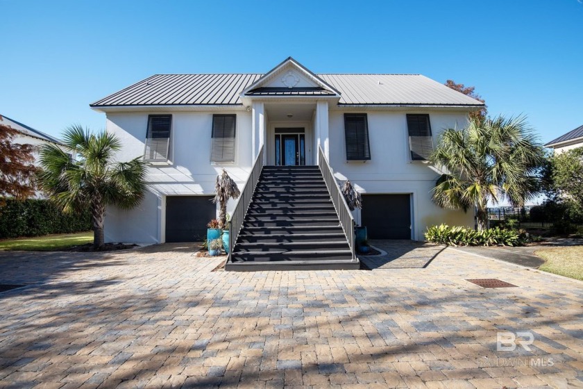 Experience waterfront living on Ono Island with this exceptional - Beach Home for sale in Orange Beach, Alabama on Beachhouse.com