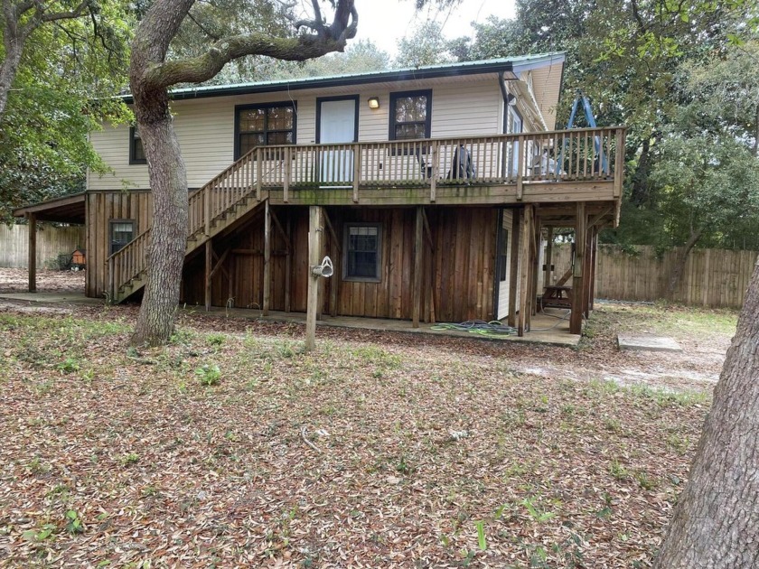 Tucked away in the laid-back coastal charm of Navarre, this - Beach Home for sale in Navarre, Florida on Beachhouse.com