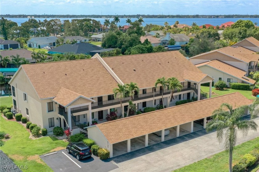 Welcome to RIVERBEND! This charming, second-story, waterfront - Beach Condo for sale in North Fort Myers, Florida on Beachhouse.com