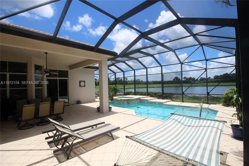 Enjoy breathtaking private sunset views from your screened patio - Beach Home for sale in West Palm Beach, Florida on Beachhouse.com