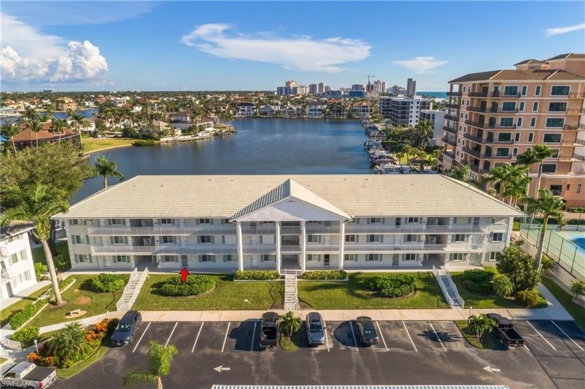 LOWEST PRICED 2 BEDROOM + DEN ON GULF SHORE DR WITH NEW HVAC & - Beach Condo for sale in Naples, Florida on Beachhouse.com