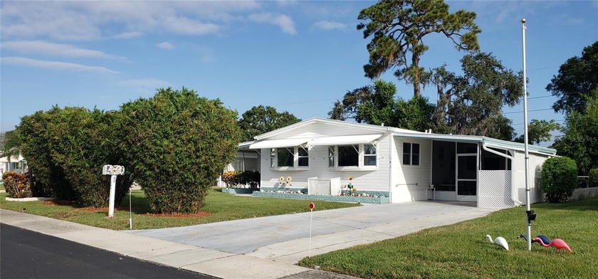 Enjoy Lake Access and a RARE FENCED YARD in this pet-friendly - Beach Home for sale in Palm Harbor, Florida on Beachhouse.com