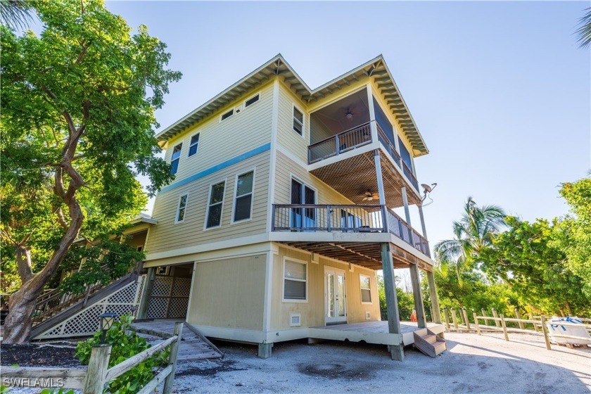 This custom-built, 4-bedroom home boasts panoramic views of the - Beach Home for sale in North Captiva Island, Florida on Beachhouse.com