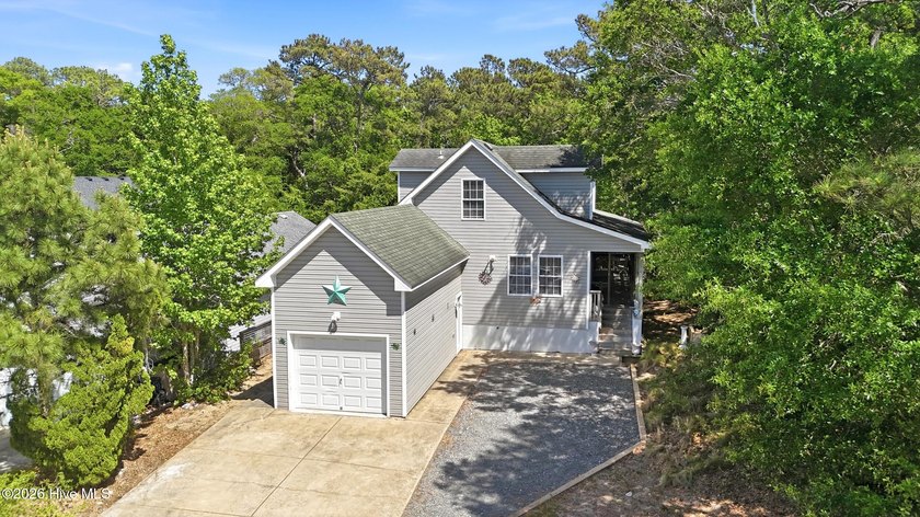 Located inside the gated community of Colington Harbour, this - Beach Home for sale in Kill Devil Hills, North Carolina on Beachhouse.com