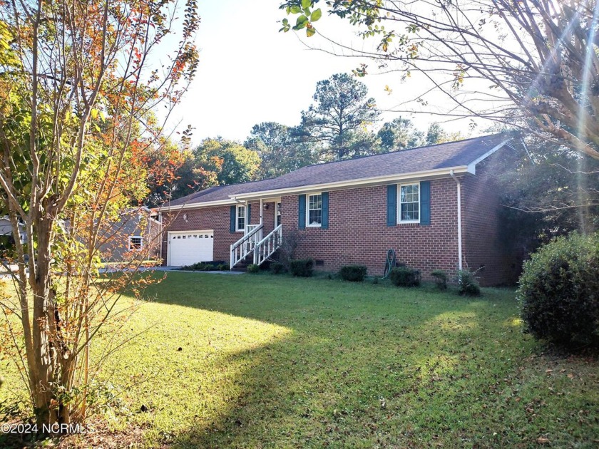 Inviting 3-Bedroom Brick Home with Sunroom Backing to the River - Beach Home for sale in New Bern, North Carolina on Beachhouse.com