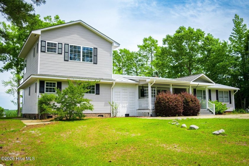 Tucked along Davenport Bay on the Scuppernong River, this - Beach Home for sale in Columbia, North Carolina on Beachhouse.com