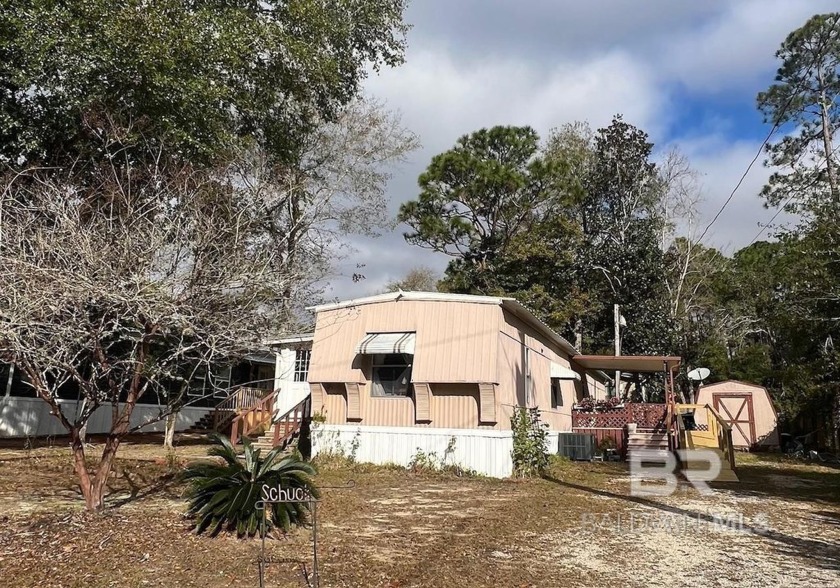 This charming 2-bedroom, 2-bath coastal home offers a relaxed - Beach Home for sale in Lillian, Alabama on Beachhouse.com