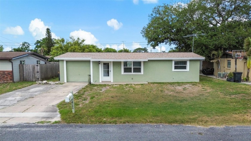 Step inside this beautifully remodeled 2-bedroom, 1-bathroom gem - Beach Home for sale in Holiday, Florida on Beachhouse.com