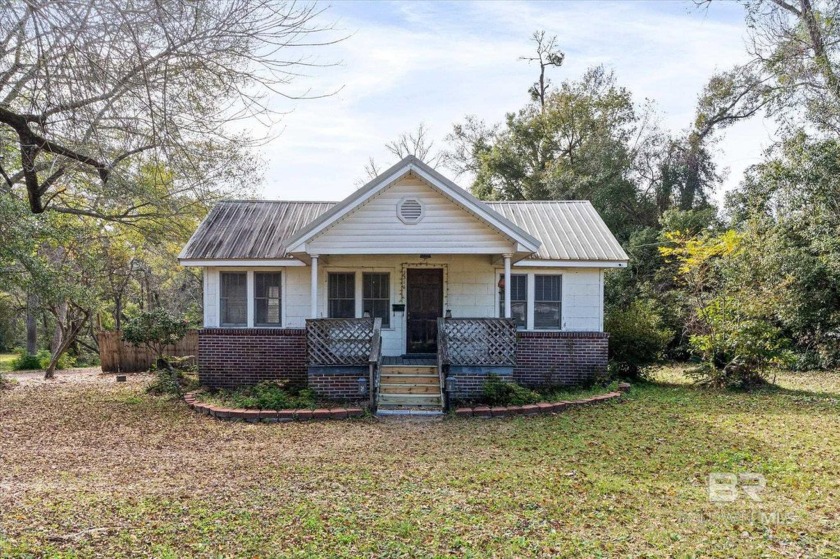 Charming property with endless potential! Nestled on over an - Beach Home for sale in Mobile, Alabama on Beachhouse.com