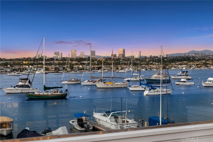 Occupying a most enviable position on Newport Harbor, this - Beach Home for sale in Newport Beach, California on Beachhouse.com