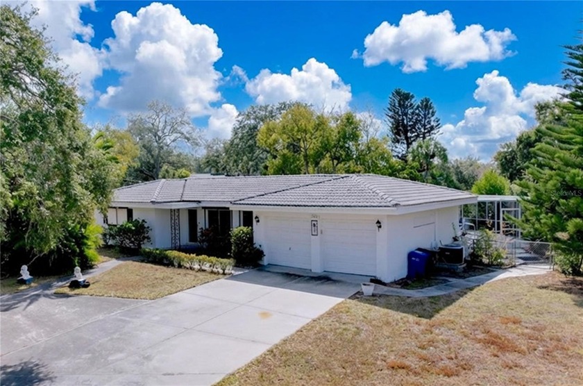 Experience the ultimate Florida lifestyle in this charming Bay - Beach Home for sale in Largo, Florida on Beachhouse.com