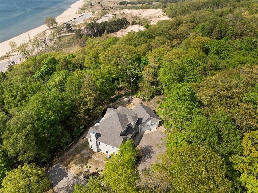 Welcome to the good Life. Nestled in the exclusive Dunegrass - Beach Home for sale in Saugatuck, Michigan on Beachhouse.com
