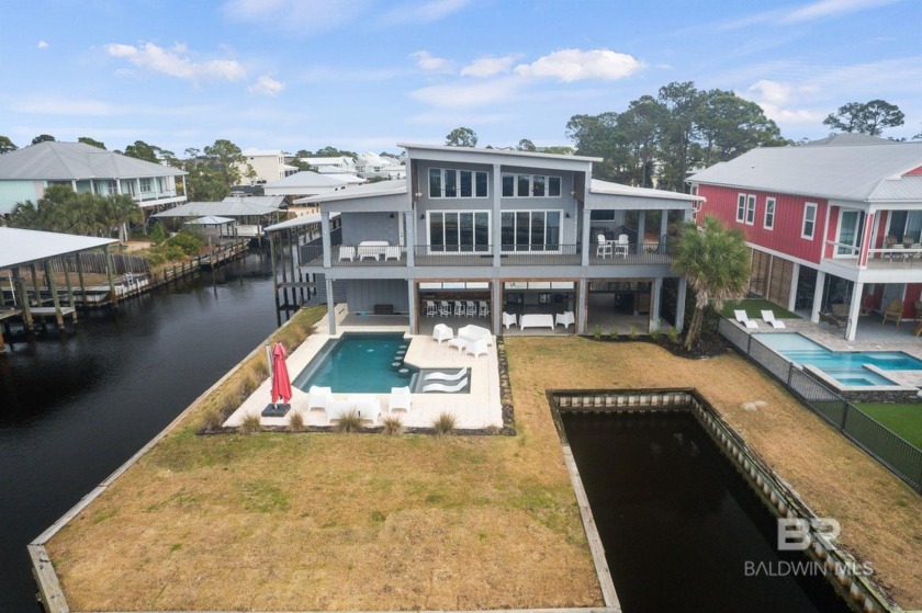 Experience waterfront living at its finest! This stunning one of - Beach Home for sale in Orange Beach, Alabama on Beachhouse.com